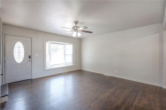 611 Pawnee Ln, Belton, MO 64012 - foyer with dark wood finished floors and a ceiling fan