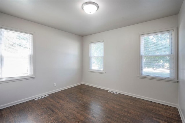 611 Pawnee Ln, Belton, MO 64012 - spare room with wood finished floors and baseboards