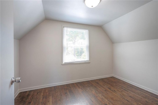 611 Pawnee Ln, Belton, MO 64012 - bonus room with vaulted ceiling and wood finished floors
