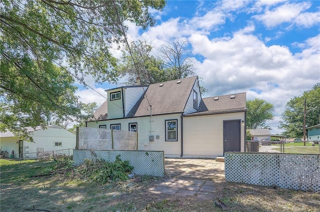 611 Pawnee Ln, Belton, MO 64012 - back of property with a shingled roof