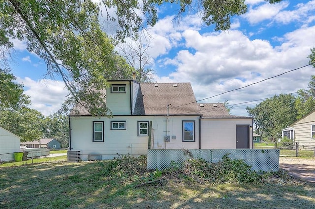 611 Pawnee Ln, Belton, MO 64012 - rear view of house with a shingled roof