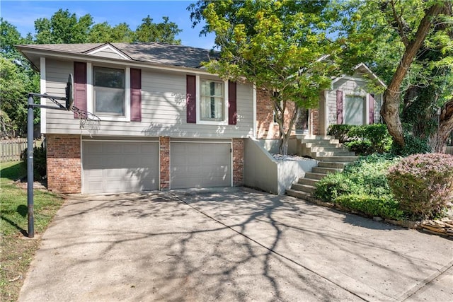 2117 Parker Ct, Blue Springs, MO 64015 - view of front facade featuring brick siding, driveway, an attached garage, and stairs