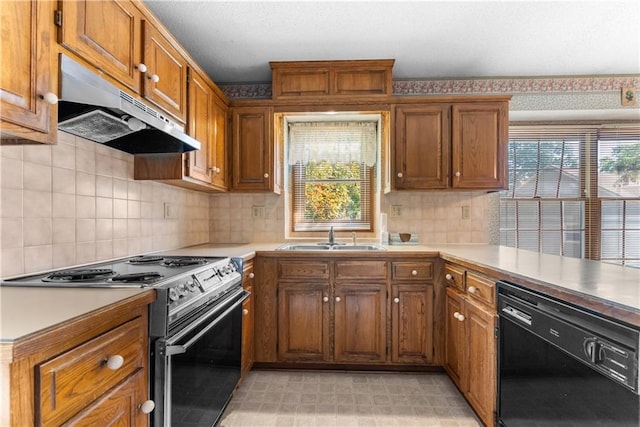2117 Parker Ct, Blue Springs, MO 64015 - kitchen with black dishwasher, under cabinet range hood, electric stove, brown cabinetry, and light countertops