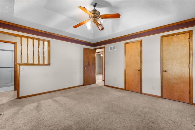 2117 Parker Ct, Blue Springs, MO 64015 - unfurnished bedroom with carpet, a raised ceiling, and ceiling fan