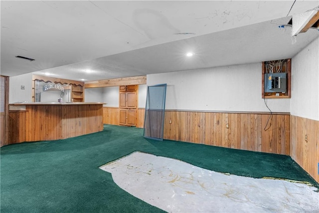 2117 Parker Ct, Blue Springs, MO 64015 - indoor bar featuring electric panel, carpet, wood walls, and wainscoting