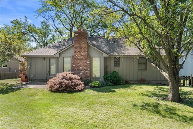2117 Parker Ct, Blue Springs, MO 64015 - view of side of property featuring board and batten siding, roof with shingles, and a chimney