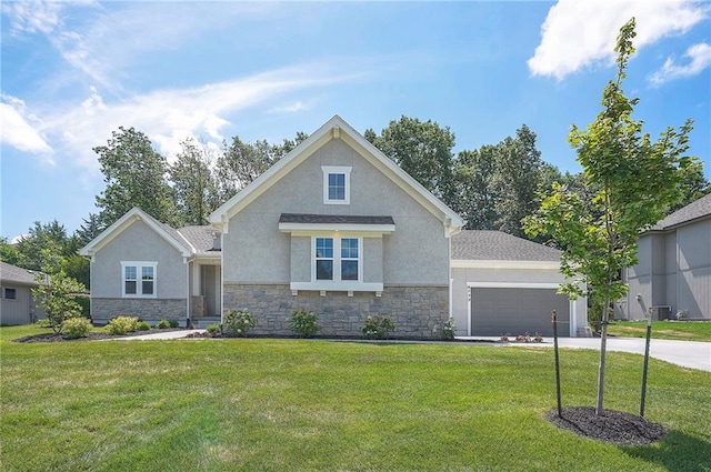 6753 Longview St, Shawnee, KS 66218 - view of front facade with stucco siding, stone siding, and driveway