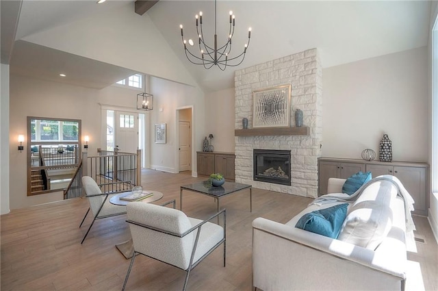 6753 Longview St, Shawnee, KS 66218 - living area featuring a chandelier, wood finished floors, high vaulted ceiling, beamed ceiling, and a fireplace