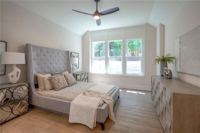 6753 Longview St, Shawnee, KS 66218 - bedroom with vaulted ceiling, light wood-style floors, and a ceiling fan
