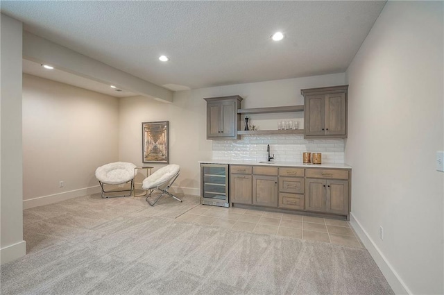 6753 Longview St, Shawnee, KS 66218 - indoor wet bar with wine cooler, light carpet, recessed lighting, backsplash, and a textured ceiling