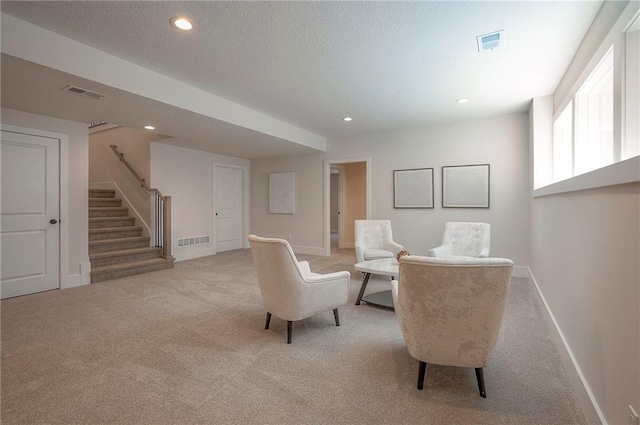 6753 Longview St, Shawnee, KS 66218 - living area featuring carpet floors, stairs, recessed lighting, and a textured ceiling