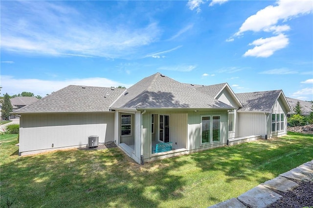 6753 Longview St, Shawnee, KS 66218 - rear view of property with a yard and roof with shingles