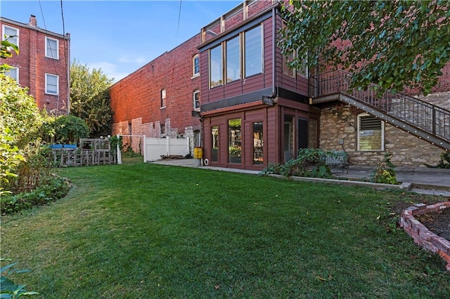 1018 Missouri Ave, Kansas City, MO 64106 - back of house with a patio area