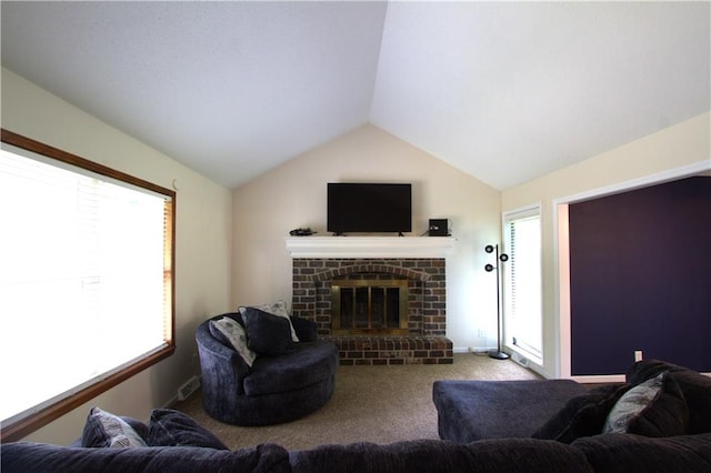 109 SE Rockwood St, Blue Springs, MO 64014 - carpeted living room featuring vaulted ceiling and a fireplace