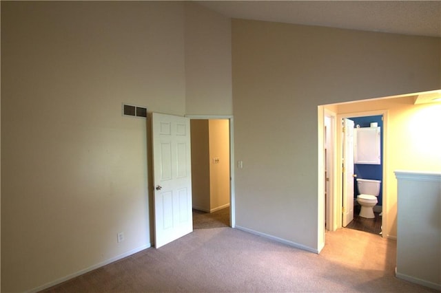 109 SE Rockwood St, Blue Springs, MO 64014 - unfurnished bedroom featuring carpet flooring, a high ceiling, and ensuite bathroom