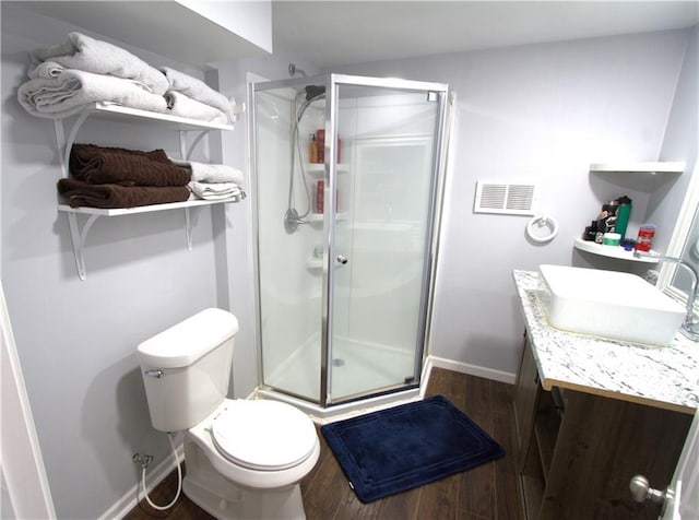 109 SE Rockwood St, Blue Springs, MO 64014 - bathroom featuring wood finished floors, a stall shower, and vanity