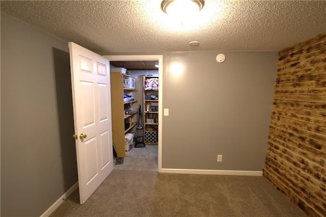 109 SE Rockwood St, Blue Springs, MO 64014 - unfurnished room featuring carpet flooring, a textured ceiling, and wooden walls