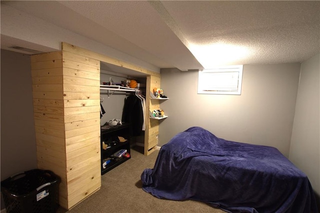 109 SE Rockwood St, Blue Springs, MO 64014 - bedroom with a textured ceiling, carpet, wood walls, and a closet