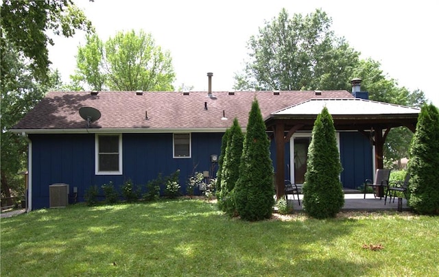 109 SE Rockwood St, Blue Springs, MO 64014 - back of house featuring a patio, a yard, board and batten siding, and a gazebo