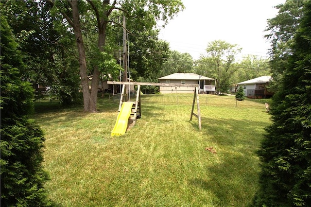 109 SE Rockwood St, Blue Springs, MO 64014 - view of green lawn featuring a playground
