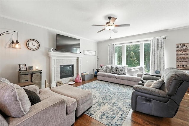 1016 SE Forest Ridge Ct, Blue Springs, MO 64014 - living room with ceiling fan, ornamental molding, wood finished floors, and a glass covered fireplace
