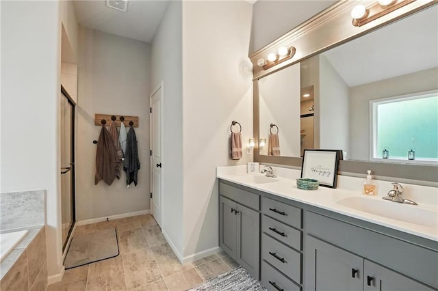 1016 SE Forest Ridge Ct, Blue Springs, MO 64014 - bathroom featuring double vanity, a shower stall, and a bath
