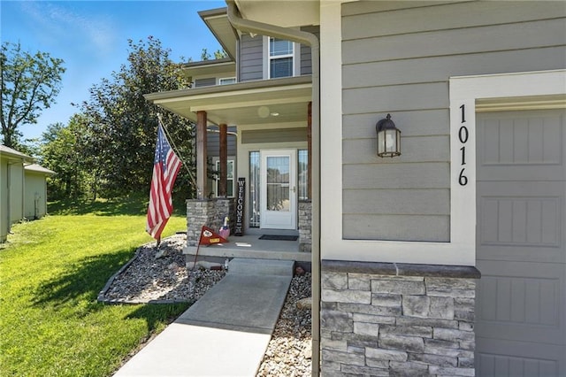 1016 SE Forest Ridge Ct, Blue Springs, MO 64014 - property entrance with a yard, a porch, and a garage