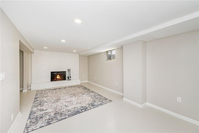 1806 E 125th St, Kansas City, MO 64146 - unfurnished living room featuring a brick fireplace, recessed lighting, and finished concrete flooring