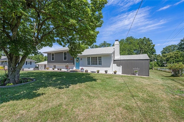 1806 E 125th St, Kansas City, MO 64146 - back of house featuring a chimney and a yard