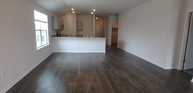 622 N Pecan St, Gardner, KS 66030 - kitchen featuring dark wood finished floors, plenty of natural light, and vaulted ceiling