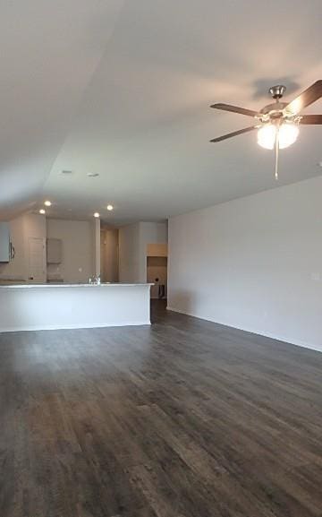 622 N Pecan St, Gardner, KS 66030 - unfurnished living room featuring dark wood finished floors, lofted ceiling, ceiling fan, and recessed lighting