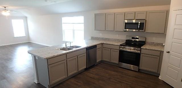 622 N Pecan St, Gardner, KS 66030 - kitchen with stainless steel appliances, gray cabinets, and a peninsula