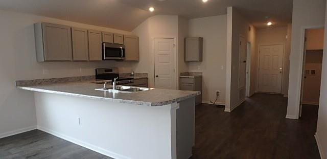 622 N Pecan St, Gardner, KS 66030 - kitchen featuring stainless steel microwave, gray cabinetry, a peninsula, dark wood finished floors, and light countertops