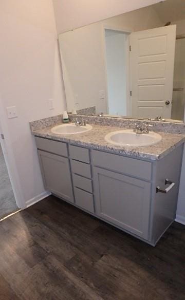 622 N Pecan St, Gardner, KS 66030 - bathroom with double vanity and wood finished floors