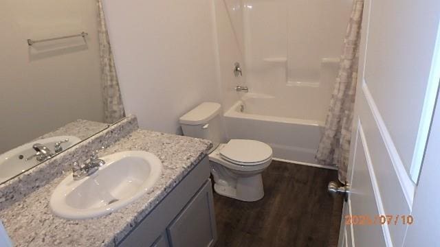 622 N Pecan St, Gardner, KS 66030 - full bathroom with vanity, wood finished floors, and shower / tub combo