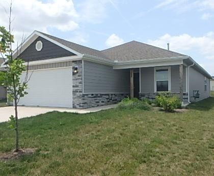 622 N Pecan St, Gardner, KS 66030 - ranch-style home featuring an attached garage, a front yard, driveway, and stone siding