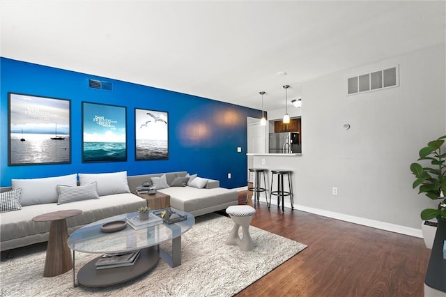 435 W 9th St Unit 204, Kansas City, MO 64105 - living area featuring wood finished floors and baseboards