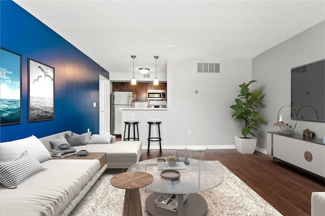 435 W 9th St Unit 204, Kansas City, MO 64105 - living area featuring dark wood finished floors and baseboards