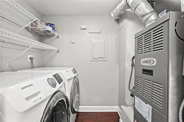 435 W 9th St Unit 204, Kansas City, MO 64105 - washroom with washing machine and clothes dryer, wood finished floors, heating unit, and electric panel