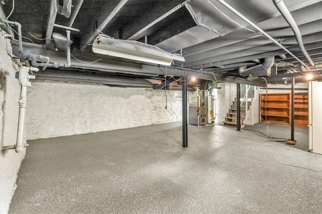 2647 Minnesota Ave, Kansas City, KS 66102 - unfinished basement featuring stairway and heating unit