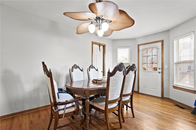 1005 Granada Dr, Raymore, MO 64083 - dining area featuring light wood-style floors, healthy amount of natural light, and ceiling fan