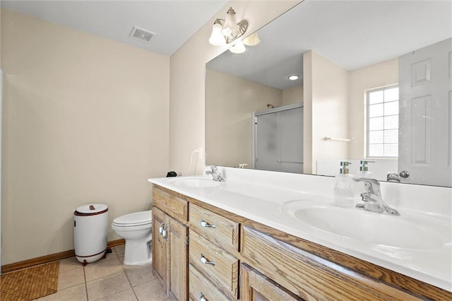 1005 Granada Dr, Raymore, MO 64083 - full bath featuring a shower stall, double vanity, and tile patterned flooring