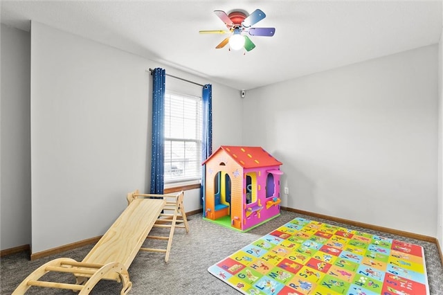 1005 Granada Dr, Raymore, MO 64083 - rec room with carpet floors and a ceiling fan