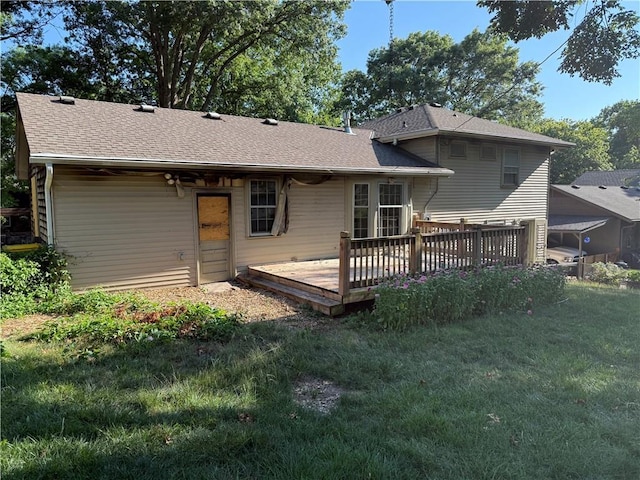 8812 W 72nd St, Overland Park, KS 66204 - rear view of house featuring a yard, a wooden deck, and a shingled roof