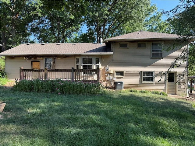 8812 W 72nd St, Overland Park, KS 66204 - back of property with a yard, a deck, and roof with shingles