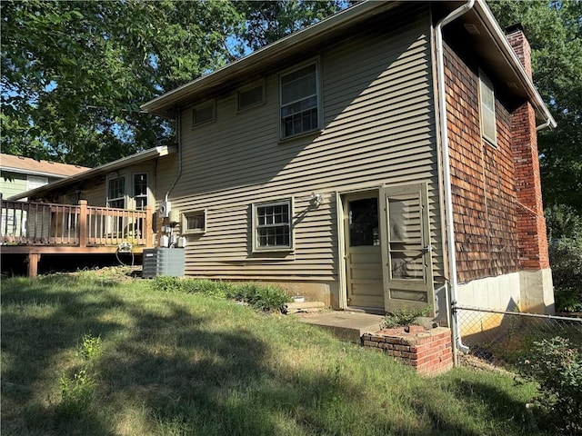 8812 W 72nd St, Overland Park, KS 66204 - rear view of house with a chimney and a deck