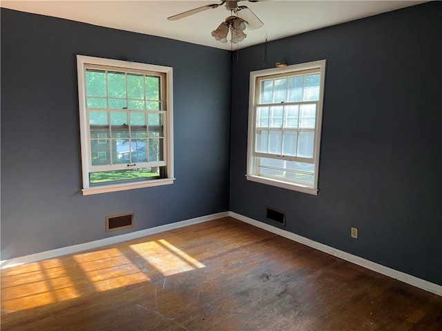 8812 W 72nd St, Overland Park, KS 66204 - spare room with healthy amount of natural light, wood finished floors, and a ceiling fan