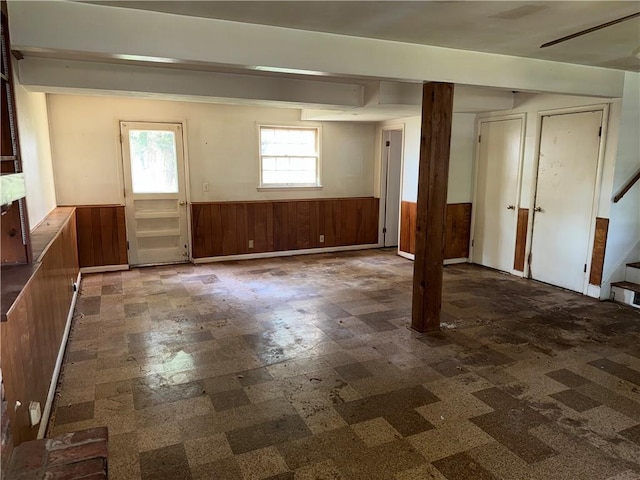 8812 W 72nd St, Overland Park, KS 66204 - basement featuring a wainscoted wall, stairway, tile patterned floors, and wood walls