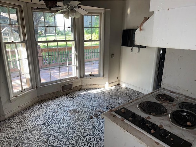 8812 W 72nd St, Overland Park, KS 66204 - kitchen featuring range, a ceiling fan, and ventilation hood