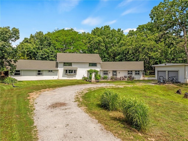 4815 Cheyenne Ln, Mclouth, KS 66054 - view of front of house with a front lawn and a garage